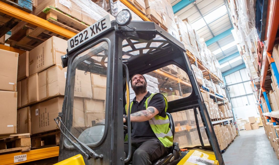Green Fulfilment Employee Working in Their Company Warehouse
