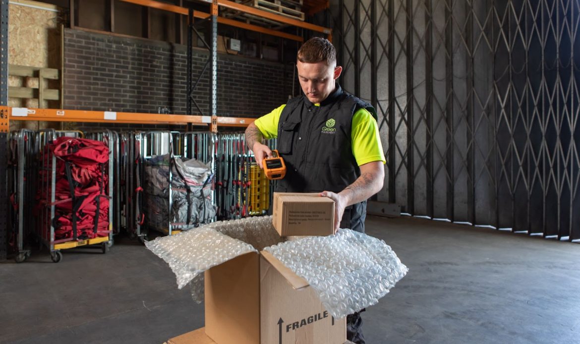 Green Fulfilment Employee Doing Some Packing