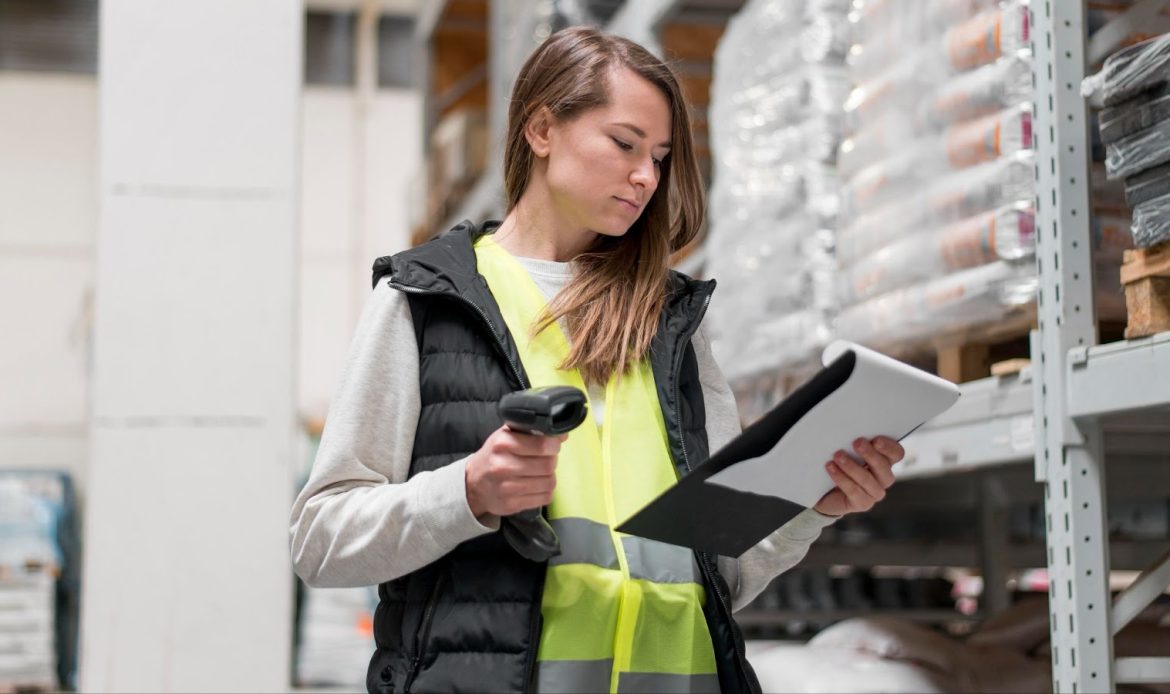 Woman Doing Audit in Warehouse