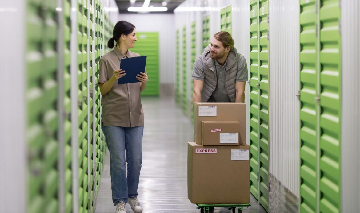 Two Employees Working in a Warehouse Centre