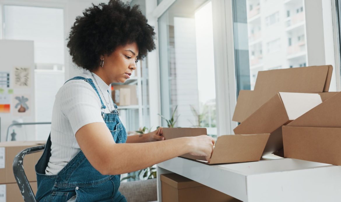 Young Woman Doing Box Packaging