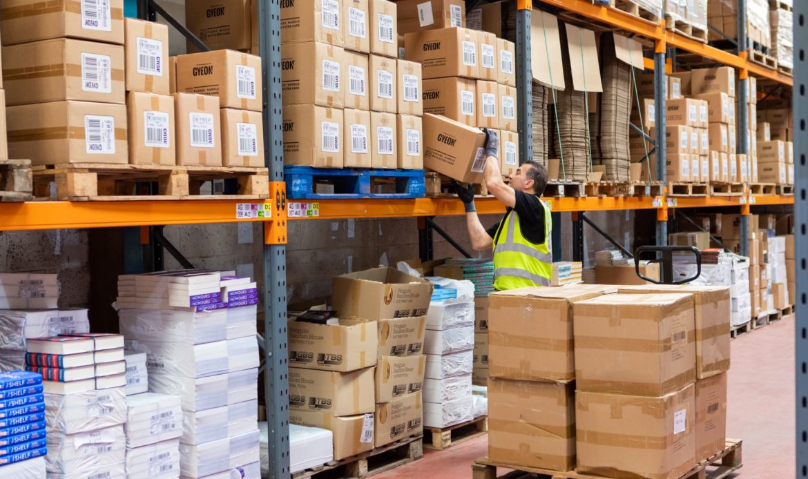 Man Working on Warehouse Sorting Products